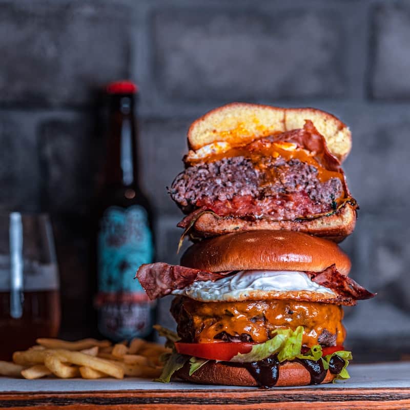Photo of a fresh looking hamburger and french fries